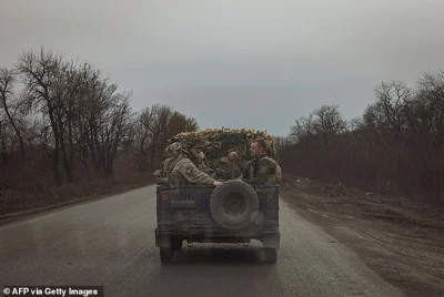 Ukrainian servicemen in gloomy scenes on a road to Chasiv Yar on March 25