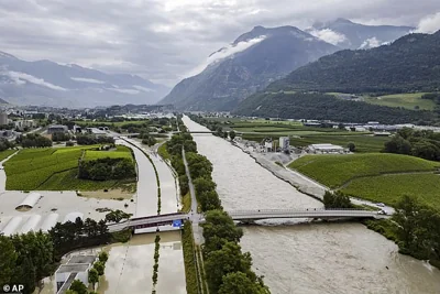 The Rhone River in Sierre is overflowing the A9 motorway following storms in Europe