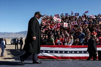 Republican presidential nominee and former U.S. President Donald Trump walks in front of his supporters during a rally at Albuquerque International Sunport, in Albuquerque, New Mexico, U.S. October 31, 2024. REUTERS/Brendan McDermid