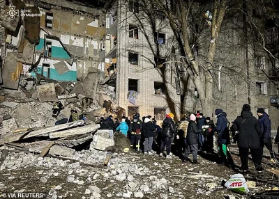 Rescuers and volunteers remove debris at the site of a residential building hit by a Russian drone strike, amid Russia's attack on Ukraine, in the town of Hlukhiv, Sumy region, Ukraine, in this handout picture released November 19, 2024