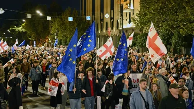 Protesters near Georgian parliament are being dispersed with water cannons