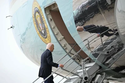 US President Joe Biden boards Air Force One at Joint Base Andrews in Maryland on October 2, 2024. - Biden is traveling to South and North Carolina to survey storm damage following Hurricane Helene. (Photo by Mandel NGAN / AFP)