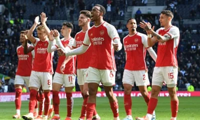 Arsenal players celebrate after victory over Tottenham Hotspur.