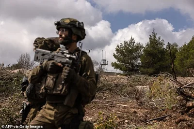 Israeli troops patrolling near a United Nations Interim Force In Lebanon (UNIFIL) base in the southern Lebanon's Naqoura region on October 13