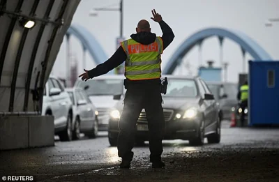 Police at the German-Polish border control traffic as enhanced border checks are introduced