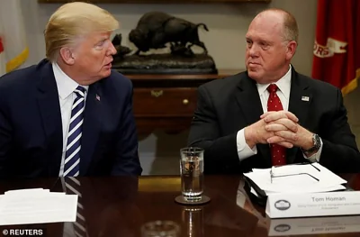 U.S. President Donald Trump speaks to Thomas Homan, acting director of U.S. Immigration and Customs Enforcement, during a round table meeting with members of law enforcement