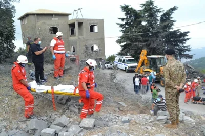 DOWNHILL FROM THERE Paramedics from the Lebanese Red Cross transport a body unearthed from the rubble at the site of an Israeli airstrike that targeted the village of Aito, northern Lebanon, on Oct. 14, 2024. AFP PHOTO