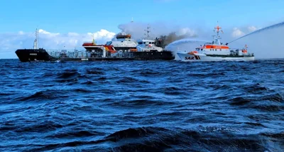 This handout photo taken and released on October 11, 2024 by the DGzRS (Deutsche Gesellschaft zur Rettung Schiffbruechiger = German Maritime Search and Rescue Service) shows smoke billowing from the German-flagged tanker ship 