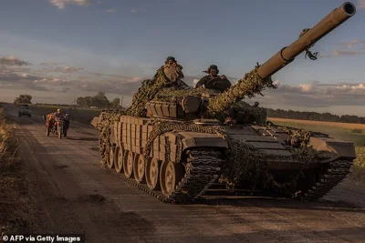 Ukrainian servicemen operate a Soviet-made T-72 tank in the Sumy region, near the border with Russia, on August 12, 2024, amid the Russian invasion of Ukraine