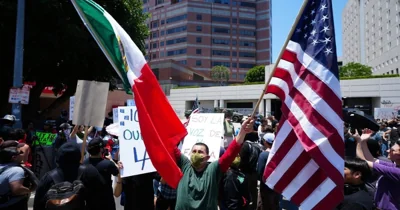 LA police swiftly enforce downtown curfew as…