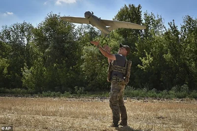 A soldier of Ukraine's National Guard launches a reconnaissance drone to determine Russian positions near the front line in Zaporizhzhia region, July 29