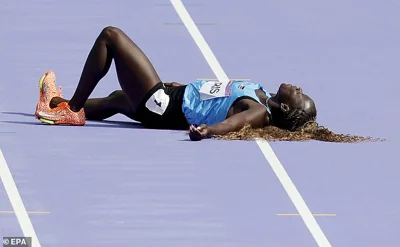 South Sudan's Lucia Moris collapsed to the floor during the women's 100m preliminary round