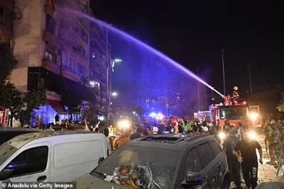 Firefighters extinguished the fire that broke out in the targeted apartment after the Israeli army carried out an airstrike on a multi-story building in the Kola district of Beirut