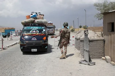 A paramilitary soldier stops and checks passenger vehicles at a security check post, a day after separatist militants conducted deadly attacks, on the outskirts of Quetta, Pakistan August 27, 2024. REUTERS/Naseer Ahmed