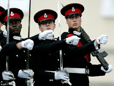 Prince William, foreground, marches with other graduates, during the Sovereign's parade at Sandhurst in 2006