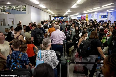 Huge queues of holidaymakers at London Gatwick Airport following the global IT outage caused by CrowdStrike software