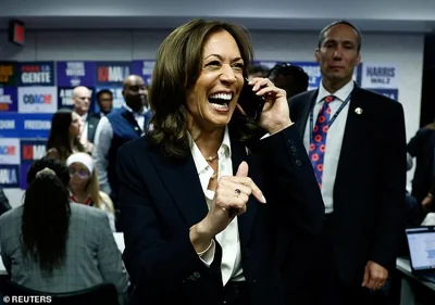 Democratic presidential nominee U.S. Vice President Kamala Harris reacts as she talks on the phone at the Democratic National Committee (DNC) headquarters during the 2024 U.S. presidential election on Election Day in Washington