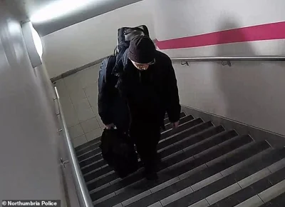 The GP, who carried a large bag, is seen making his way up the stairs