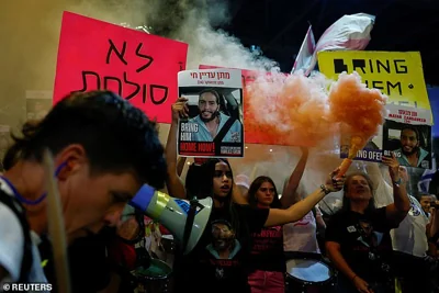 People attend a demonstration to protest against the government and to show support for the hostages who were kidnapped during the deadly October 7 attack by Hamas, in Tel Aviv