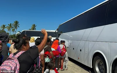 Migrants who took part in caravans toward the U.S. board buses bound for different cities in Tehuantepec, Mexico on November 24. Mexican President Sheinbaum said Mexico was already taking steps to stop the caravans headed toward the U.S. before they reach the border