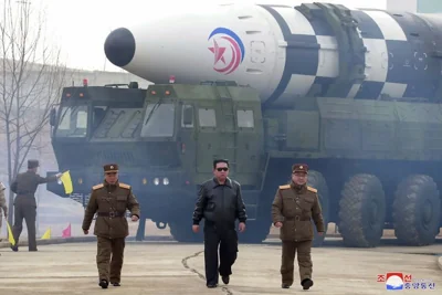  Kim Jong Un walks around what it says is a Hwasong-17 intercontinental ballistic missile (ICBM) on the launcher at an undisclosed location in North Korea, 24 March 2022