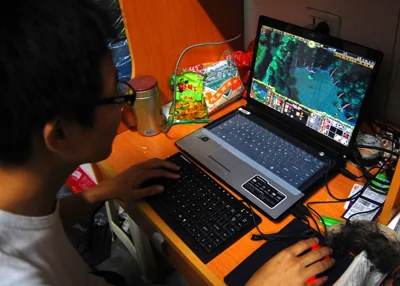 A student playing World of Warcraft in their dorm