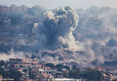 Smoke billows over Khiam, amid ongoing hostilities between Hezbollah and Israeli forces, as pictured from Marjayoun, near the border with Israel, Lebanon October 30, 2024