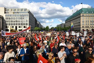 Participants gather for a demonstration against the far right and to condemn attacks on politicians, at Pariser Platz square in front of the Brandenburg Gate in Berlin, Germany on May 5, 2024