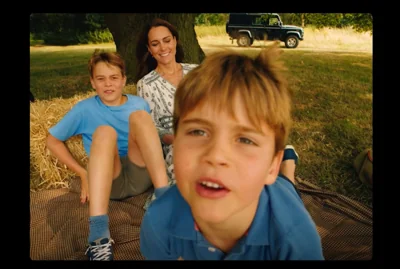 In the video, Charlotte and Louis press their faces near the lens giggling and both saying “Hello”.