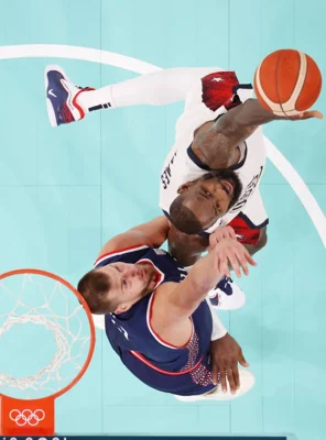 BATTLE FOR GOLD American LeBron James (right) vies with Serbian Nikola Jokic during the men’s basketball semifinal game at the Paris 2024 Olympic Games in Paris, France, on Aug. 8, 2024. XINHUA PHOTO