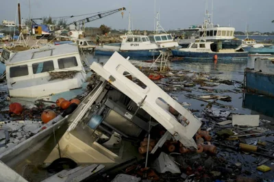 Fishing boats damaged by Hurricane Beryl wade in the water at the Bridgetown Fisheries, Barbados, Tuesday, July 2, 2024. AP PHOTO