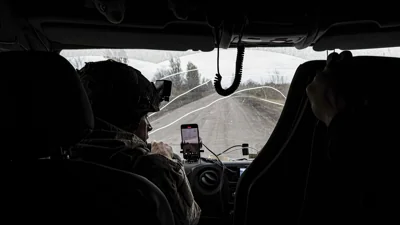 Pipa Vasyl, a policeman of the "White Angels" drives in an armoured minivan during en evacuation in Kurakhove, Donetsk region, Ukraine, on Nov. 4, 2024