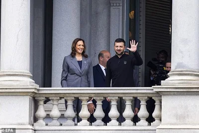 Vice President Kamala Harris and Ukrainian President Volodymyr Zelensky wave from the balcony of the Eisenhower Executive Office Building