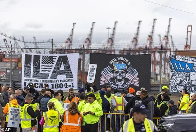 Workers take part in a port strike at Port Newark, Tuesday, Oct. 1, 2024, in Bayonne, N.J.