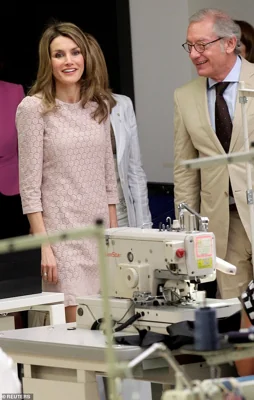 Isak Andic, Chief Executive of Spanish fashion label Mango, stands next to Spanish Princess Letizia, during her visit to Mango's factory in Palau-Solita i Plegamans, near Barcelona, April 7, 2011