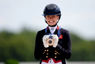 Great Britain’s Charlotte Fry with her bronze medal following the dressage individual Grand Prix Freestyle (John Walton/PA)