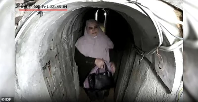 This is the moment Hamas leader Yahya Sinwar's wife is spotted seemingly holding a $32,000 bag in the tunnel leading to his secret lair