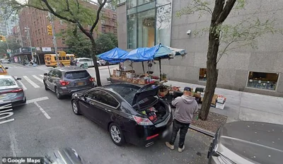 Shah Alam, 74, works for $12 an hour at this fruit stand outside Sotheby's auction house on Manhattan's Upper East Side