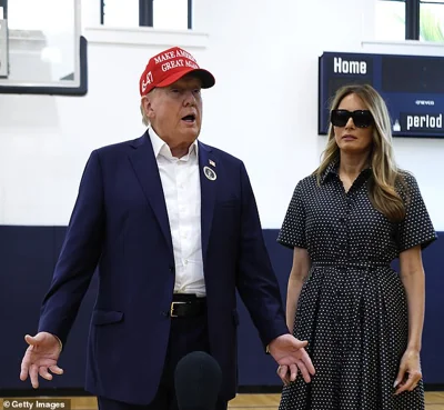 Donald and Melania Trump speak to reporters after casting their ballots in the 2024 election in Palm Beach, Florida on Tuesday, November 5