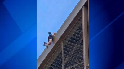 Police arrest man climbing Eiffel Tower, prompting evacuation hours before closing ceremony