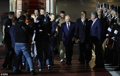 Russian President Vladimir Putin (C-R) meets Russian citizens released after the Russian-US prisoner swap in Turkiye at Vnukovo International Airport in Moscow
