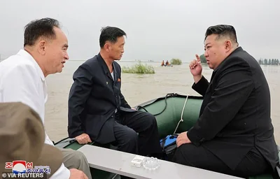 North Korean leader Kim Jong Un and Premier Kim Tok Hun visit a flood-affected area near the border with China, in North Pyongan Province, North Korea