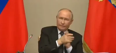 Putin strangely squints and rubs hands while addressing military chiefs