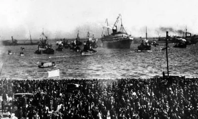 Huge crowds line the dockside to await the arrival of the victorious Uruguayan football team as their ship returns to Montevideo from France in 1924. The Uruguayan team beat the Switzerland team 3-0 to win the gold medal in the final of the football tournament at the 1924 Summer Olympics.