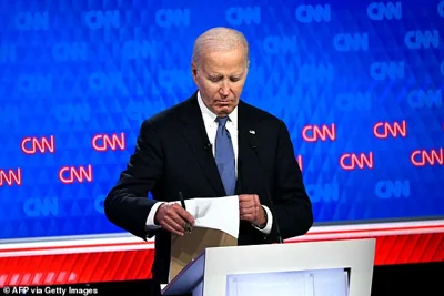 At times, President Biden looked blankly into the camera or down at his notes while Trump was speaking