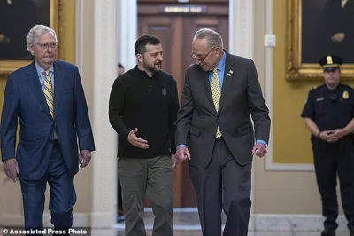 Ukrainian President Volodymyr Zelenskyy, center, walks with Senate Minority Leader Mitch McConnell, R-Ky., left, and Senate Majority Leader Chuck Schumer, D-N.Y.