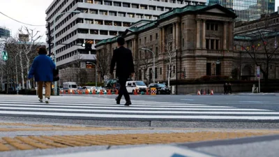 Yen slides with JGB yields after BOJ cuts growth forecasts