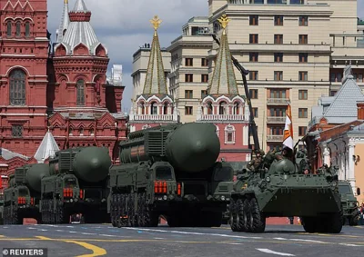 The current Russian nuclear doctrine, adopted in 2020, only allows for nuclear retaliation in the case of a nuclear attack or an existential threat. Pictured: A Russian BTR-82A armoured personnel carrier and Yars intercontinental ballistic missile systems