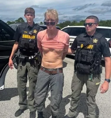 Ryan Wesley Routh, the gunman accused of trying to kill Donald Trump on Sunday, appeared in federal court appearance with his hands and feet in shackles on Monday. Pictured: Police released on Monday an image of Routh's arrest after he was able to flee 50 miles from Trump International Golf Club