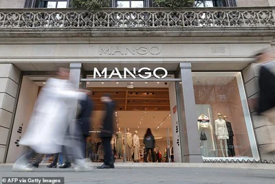 Pedestrians walk by the entrance of a Mango shop on Passeig de Gracia street in Barcelona on February 28, 2024 (file image)